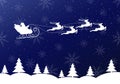 Santa Claus sleigh with reindeer flying in the night sky. Winter landscape with snowflakes and Xmas trees. Royalty Free Stock Photo